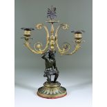 A 19th Century French Bronze and Gilt Metal Two Light Candelabrum, in the Empire manner, 15ins high