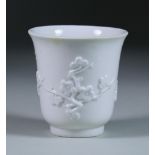 A Chelsea White Beaker, Circa 1750-52, moulded with three flowering prunus sprays, 3.125ins high,
