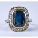 A Late 19th/Early 20th Century Sapphire and Diamond Ring, set with a centre faceted sapphire,
