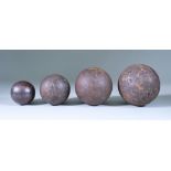 Four Large Steel Shot, two English, 3ins and 4ins, plus two others, 60mm and 90mm in diameter