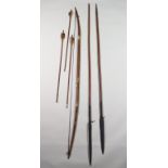 Two African Spears and a Bow, 19th Century, the spears being 74ins and 71ins respectively, the bow