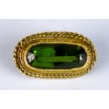 A Late 19th/Early 20th Century Faceted Peridot Brooch, yellow metal, set with a centre faceted