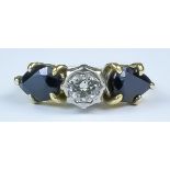 A Sapphire and Diamond Ring, 20th Century, yellow metal set with a centre brilliant cut white