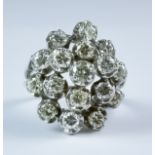 A Diamond Cluster Ring, Modern, 18ct white gold set with seventeen brilliant cut white diamonds,