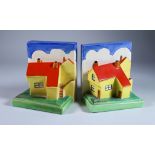 A Pair of Clarice Cliff Bizarre Cottage Bookends, shape 410 modelled with yellow cottages with red