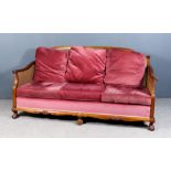 An Early 20th Century Mahogany Framed Three-Piece Bergere Lounge Suite, with cane panelled backs and