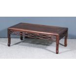 A Chinese Rosewood Rectangular 'Opium' Table, with flush panel top and pierced frieze, on shaped