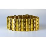 A Modern Bar and Twist Bracelet, by Carl Weingrill, 18ct gold, 180mm x 25mm, gross weight 62.9g