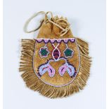 A Native American Smoke Tanned Hide Pouch, Circa 1880, a small hide bead decorated hide pouch (