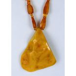 A Large Abstract Amber Necklace, the necklace fashioned from lozenge shaped amber pieces,