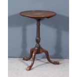 A George III Mahogany Circular Tripod Occasional Table, with moulded rim to top, on turned and