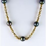 A Gold and Tahitian Pearl Necklace, Modern, yellow metal interspaced with 10 Tahitian pearls, each