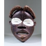 A Dan Mask, Ivory Coast, with carved headpiece and white painted eyes, second half 20th Century 11.