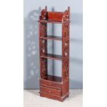 A Mahogany Four-Tier Shelf Unit, with moulded edge to top, each tier with fretted panels to each