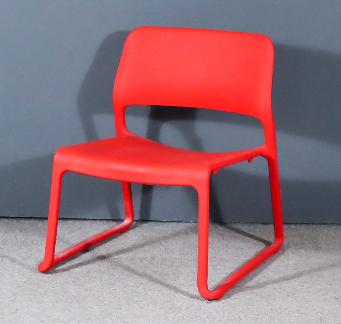 After Donal Chadwick (born 1936) - Knoll "Spark Series" Red Plastic Chair