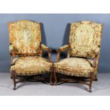 Two Continental Walnut Armchairs, seat, backs and arms upholstered in needlework, on X-pattern