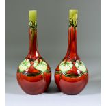 A Pair of Minton Secessionist Sol-Fleur Bottle Vases, Circa 1910, tube lined in green with white