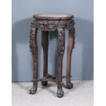 A Chinese Carved Rosewood Octagonal Jardiniere Stand, the top inset with red veined marble and