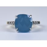 A Chalcedony and White Sapphire Ring, Modern, 14ct gold set with a faceted chalcedony stone,