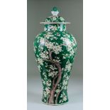 A Chinese Porcelain Baluster-Shaped Vase and Cover, Early 20th Century, enamelled in famille verte