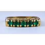 A Five Stone Emerald Ring, Modern, 18ct gold set with faceted emeralds, approxmiately .50ct total,