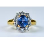 A Sapphire and Diamond Ring, Modern, 18ct gold set with a centre sapphire, approximately 1ct,