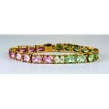 A 14ct Gem Set Line Bracelet, Modern, set with twenty-two faceted gem stones, 190mm overall, gross