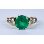 An Emerald and Diamond Ring, Modern, 14ct gold set with a centre emerald, approximately 1.50ct