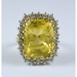 A Citrine and Diamond Ring, Modern, 18ct gold set with a centre faceted citrine stone, approximately