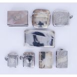 A George V Plain Silver Rectangular Card Case and a Selection of Silver and Plated Vesta Cases,