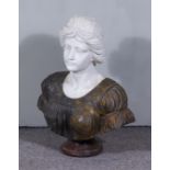 A Continental White, Grey and Yellow Flecked Marble Bust of a Young Woman with Headdress, on