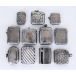 A Victorian Silver Combination Vesta Case/Wick Holder and a Selection of Vesta Cases, the