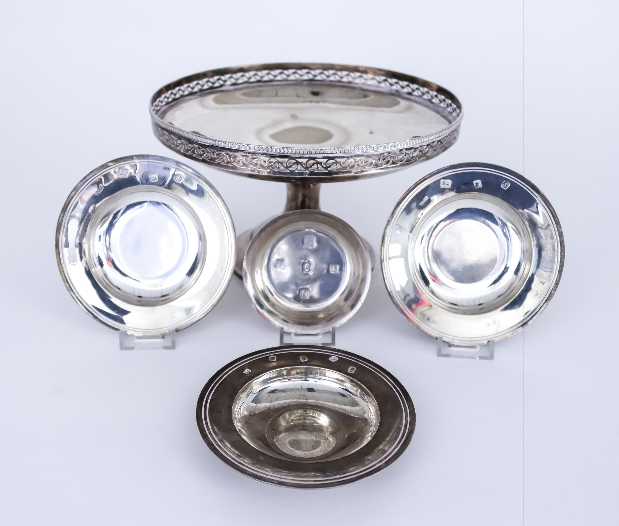 A George V Silver Circular Tazza, Three Silver "Armada" Dishes and a Coaster, the tazza by I.S.