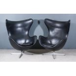 After Arne Jacobsen (1902-1971) - A Pair of Black Leather and Chrome "Egg" Swivel Chairs, on X-