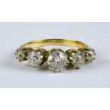 A Five Stone Diamond Ring, 20th Century, 18ct gold set with five graduated brilliant white diamonds,
