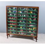 An Oak Glass Fronted Display Cabinet containing Fifty-Nine Assorted Model Cars, various makes and