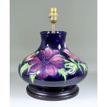 A Modern Moorcroft Pottery Table Lamp, tube-lined and decorated in colours with a poppy design,