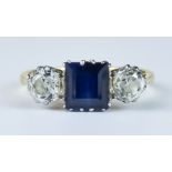 A Late 19th/Early 20th Century Three Stone Sapphire and Diamond Ring, 18ct gold set with a centre