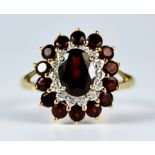 A Garnet and Diamond Ring, Modern, 9ct gold set with a centre faceted garnet, approximately 1.5ct,