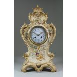 A 19th Century French Porcelain Cased Mantel Clock, the 4.25ins diameter dial with Arabic numerals