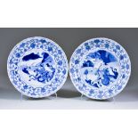 Two Chinese Kangxi Blue and White Porcelain Plates, painted with hunting scenes within floral and