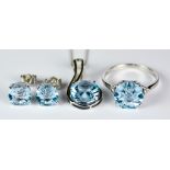 A Blue Topaz Suite, Modern, 9ct white gold ring set with a centre faceted blue topaz stone,