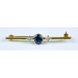 A Sapphire and Diamond Bar Brooch set with a centre sapphire stone, approximately .50ct, flanked