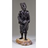 A Japanese Brown Patinated Bronze Figure of a Young Woman Carrying her Sandals, 10.5ins (26.7cm)