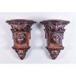 A Pair of Florentine Wood Wall Brackets, 19th Century, carved with acanthus and portraits, 14ins