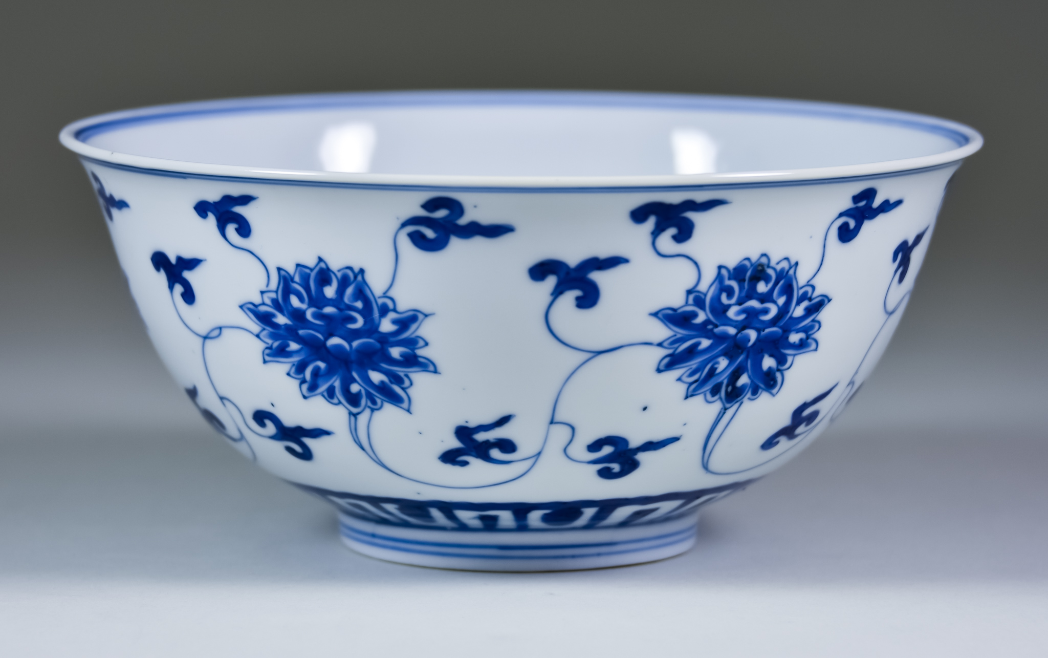 A Chinese Kangxi Blue and White Porcelain Circular Bowl, painted with lotus flowers, 6.5ins (16.5cm)