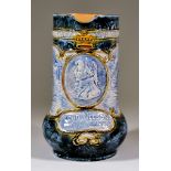 A Royal Doulton Pottery Commemorative Vase, moulded in relief and decorated in colours with a