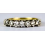 A Seven Stone Diamond Ring, Modern, 18ct gold set with seven brilliant cut white diamonds,