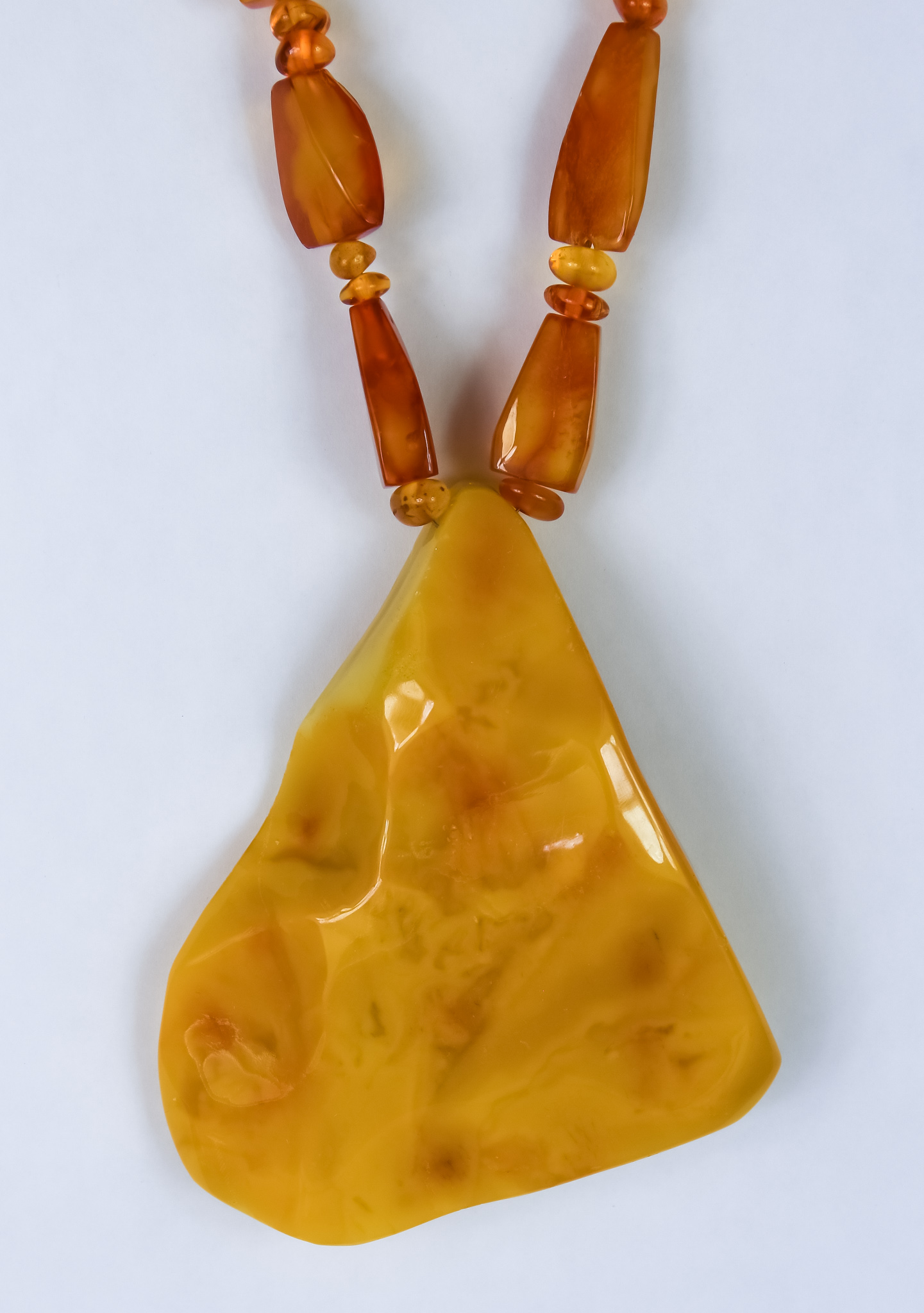 A Large Abstract Amber Necklace, the necklace fashioned from lozenge shaped amber pieces,