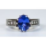 A Sapphire and Diamond Ring, Modern, 18ct gold set with a centre sapphire, approximately 1.2ct,